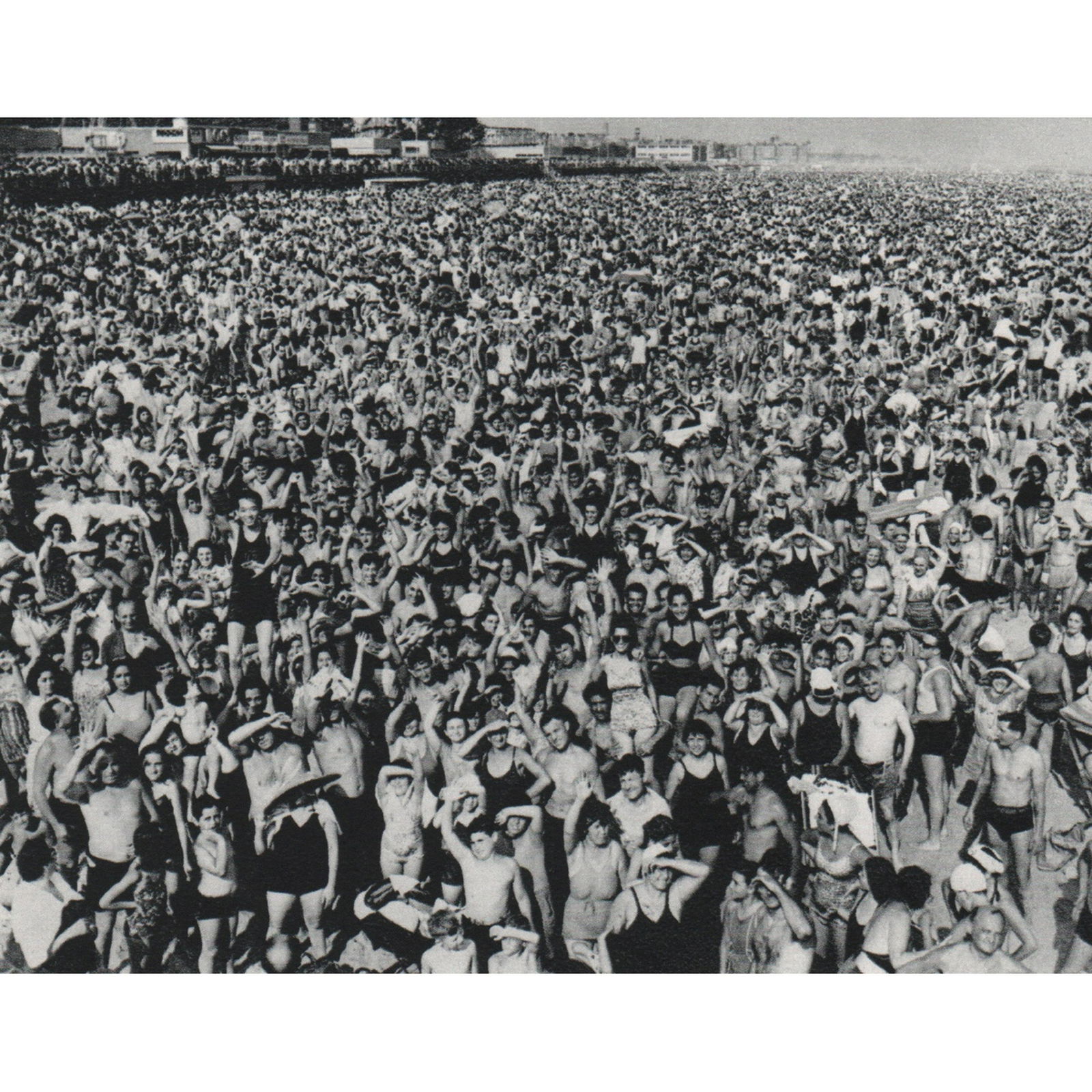 WEEGEE - Coney Island Beach, 1940: Artist: WEEGEE Print Title: Coney Island Beach, 1940 Medium: Sheet-fed Gravure Printing Date: 1970's Printed in Switzerland Image Size approx: 4.5 x3.75 inches Arthur (Usher) Fellig (1899-1968), know