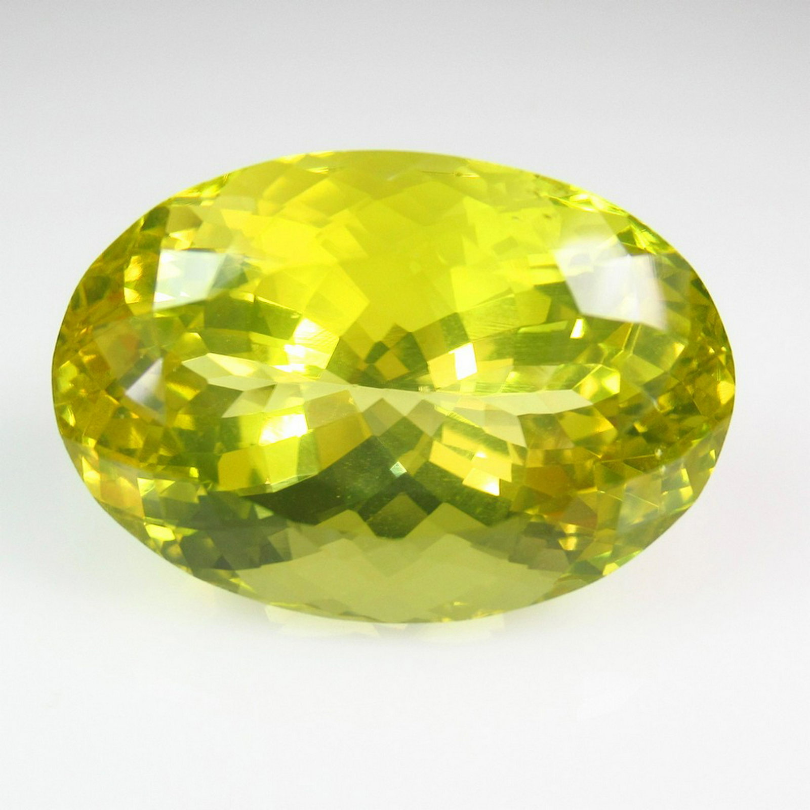50.47 Ctw Natural Lemon Quartz 28X19.5 mm Oval: Title: 50.47 Ctw Natural Lemon Quartz 28X19.5 mm Oval Stone Clarity: VVS Gemstones: Lemon Quartz Carat Weights: 50.47 Size/Dimensions: 28.00 x 19.50 x 17.00 mm Additional Information: Top Class Luster