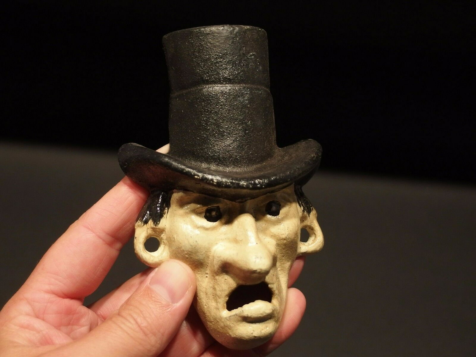 Cast Iron Abe Lincoln Folk Art Figural Beer Bottle: 3 5/8" Tall x 3 1/2" Wide Great reproduction cast iron bottle opener. This piece was made to look just like an antique, but is new. All of our items come with a 100% customer satisfaction guarantee. R