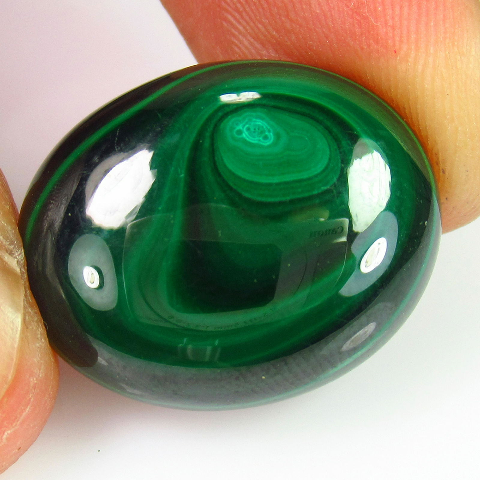 23.29 Ct Genuine Green Malachite Oval Cab: No Reserve! Title: 23.29 Ct Genuine Green Malachite Oval Cab Stone Clarity: Opaque Gemstones: Natural Malachite Carat Weights: 23.29 Size/Dimensions: 22.00 x 16.70 x 5.80 mm Additional Information: Ni