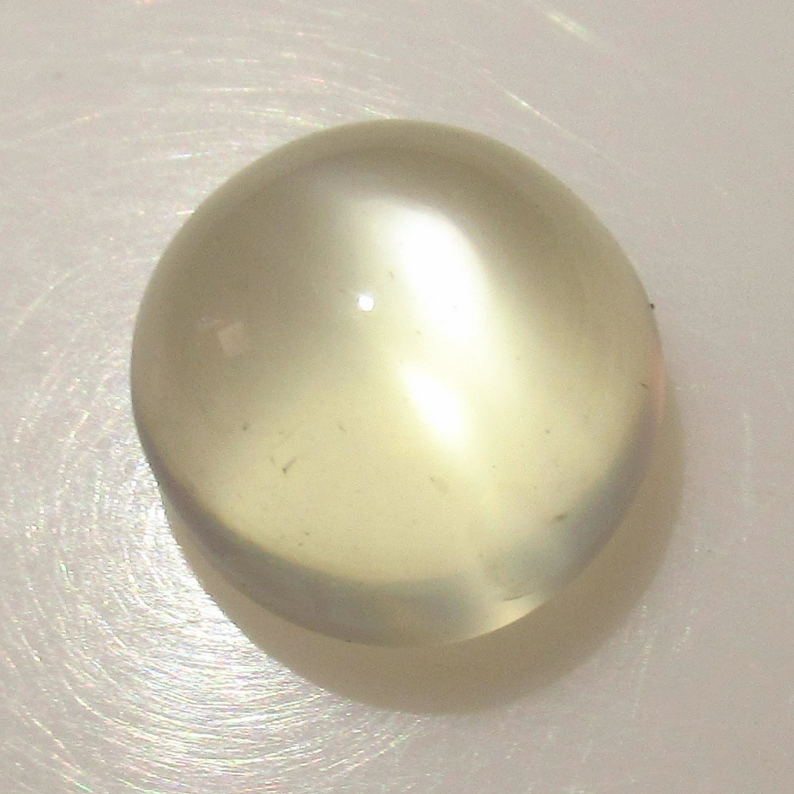 6.37 Ct Genuine Moonstone Catseye 11 mm Round Cab: No Reserve! Title: 6.37 Ct Genuine Moonstone Catseye 11 mm Round Cab Stone Clarity: Transparent Gemstones: Natural Moonstone Catseye Carat Weights: 6.37 Size/Dimensions: 11.00 x 11.00 x 7.20 mm Additi
