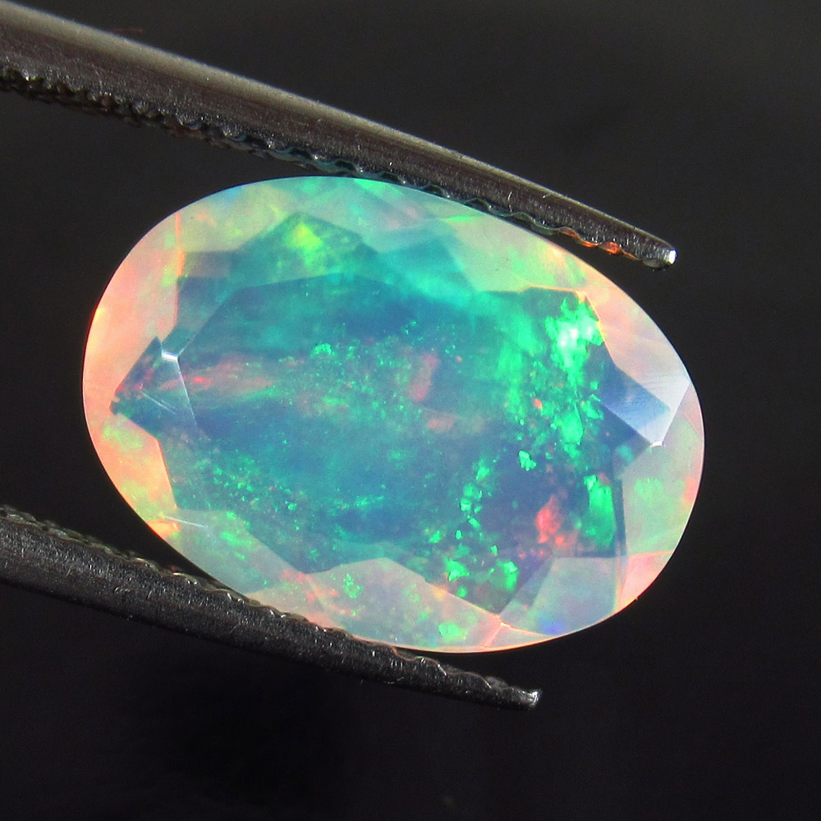 2.06 Ct Genuine Multi-Color Fire Faceted Opal Oval Cut (1 of 2)