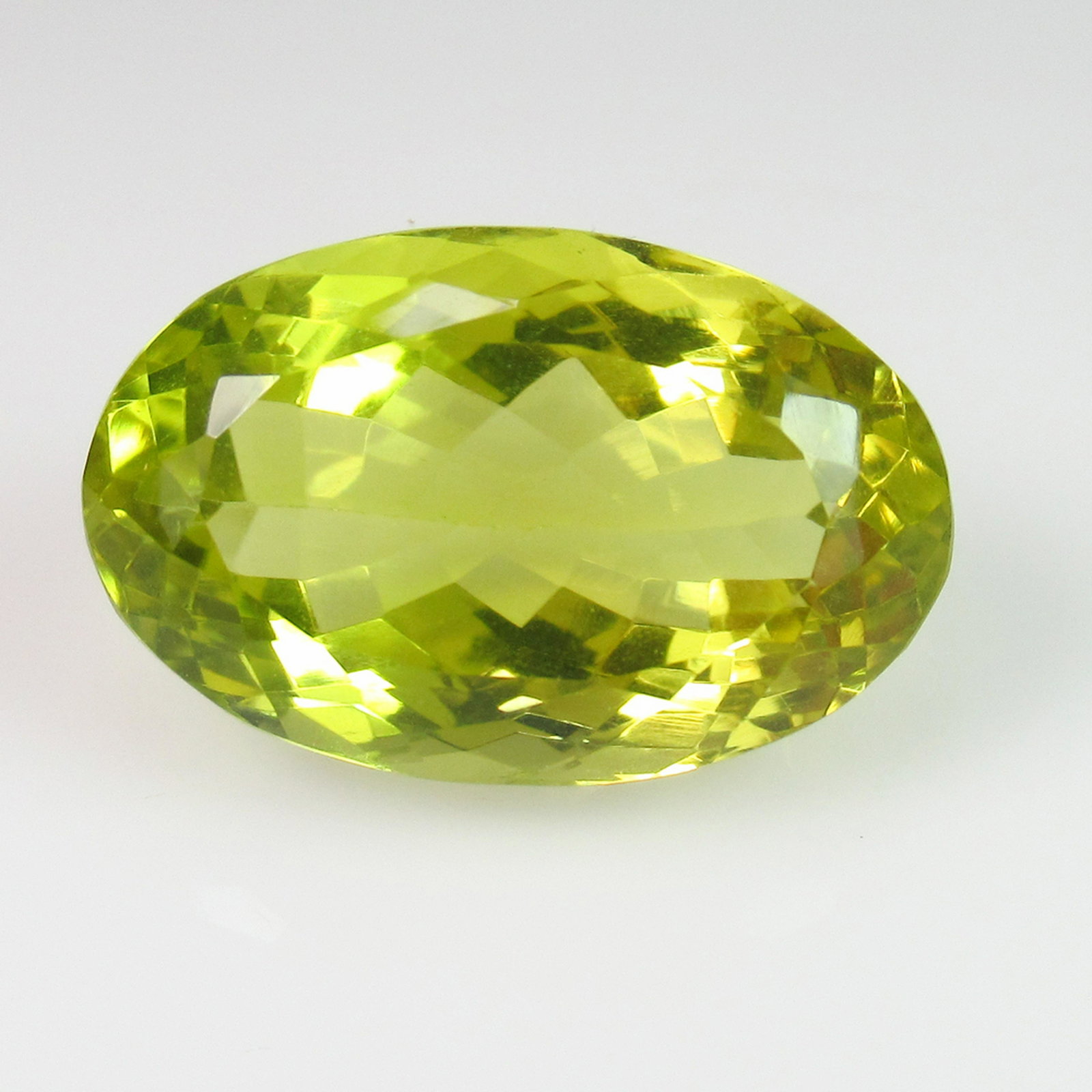 21.69 Ct Genuine Fine Lemon Quartz 27X14 mm Oval Cut: No Reserve! Title: 21.69 Ct Genuine Fine Lemon Quartz 27X14 mm Oval Cut Stone Clarity: VVS Gemstones: Natuarl Lemon Quartz Carat Weights: 21.69 Size/Dimensions: 27.00 x 13.90 x 10.60 mm Additional Inf