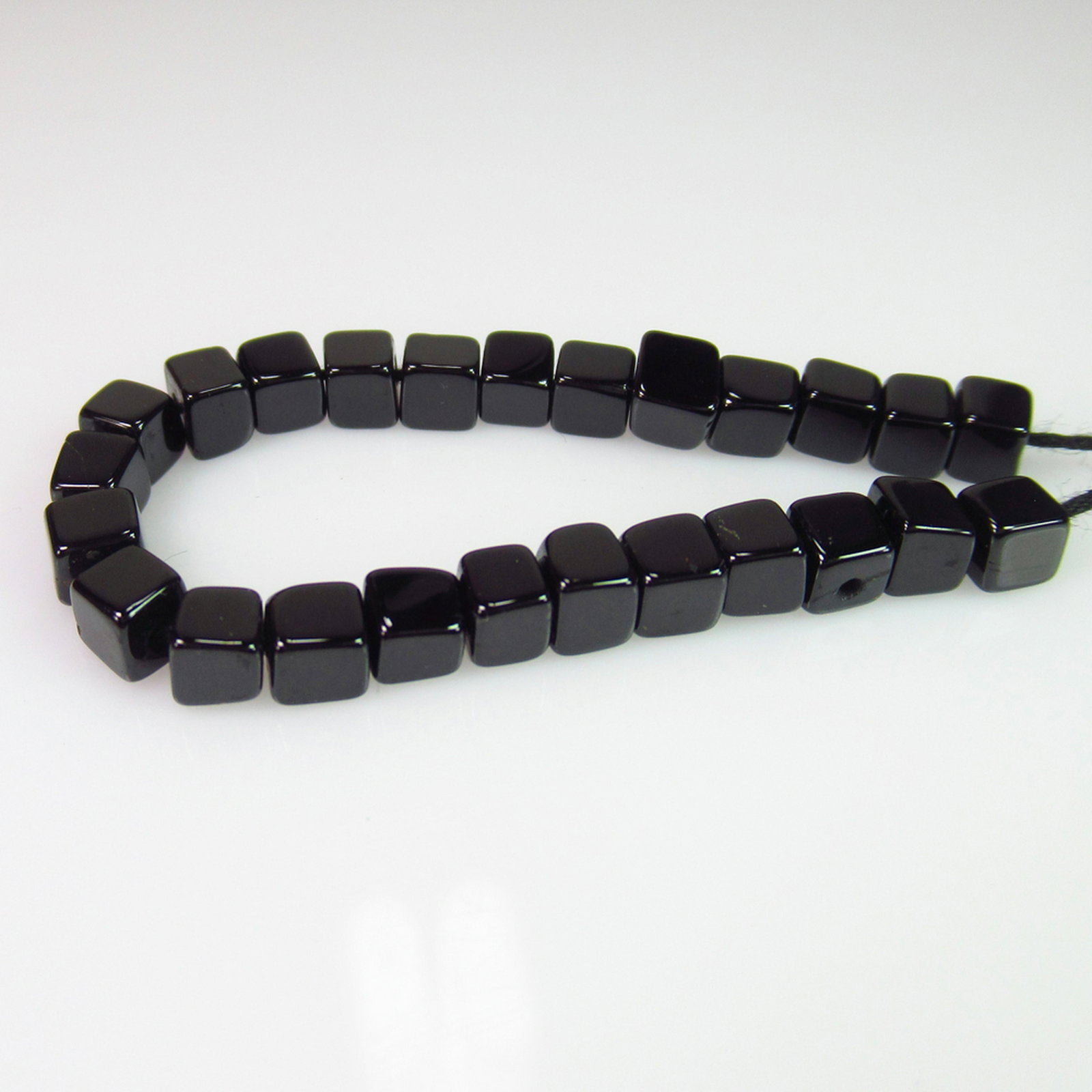 19.69 Ct Genuine 25 Drilled Black Spinel Square Beads: No Reserve! Title: 19.69 Ct Genuine 25 Drilled Black Spinel Square Beads Stone Clarity: Opaque Gemstones: Natural Black Spinel Beads Carat Weights: 19.69 Size/Dimensions: 3.60 to 3.90 / 25 PC's Additi