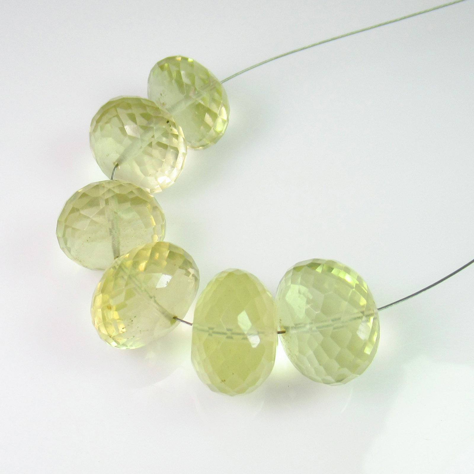 70.11 Ct Genuine 6 Drilled Lemon Quartz Round Beads: No Reserve! Title: 70.11 Ct Genuine 6 Drilled Lemon Quartz Round Beads Stone Clarity: Transparent Gemstones: Natuarl Lemon Quartz Beads Carat Weights: 70.11 Size/Dimensions: 12.60 to 13.70 mm / 6 PC's