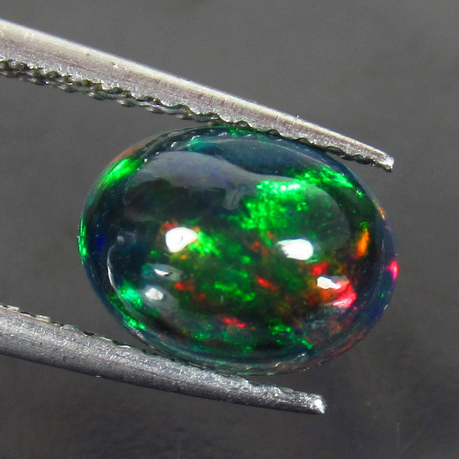 1.38 Ct Genuine Ethiopian Fire Black Opal Oval Cab (1 of 2)