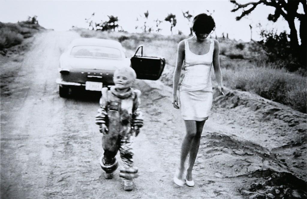 PETER LINDBERGH - Helena Christensen & Alien . El: Artist: Peter Lindbergh Title: Helena Christensen & Alien . El Mirage, California, 1990 Date Printed: 2008 Medium: Photo Litho with Copyright Peter Lindbergh Printer Location: ItalySize: 14.5x22 cm -