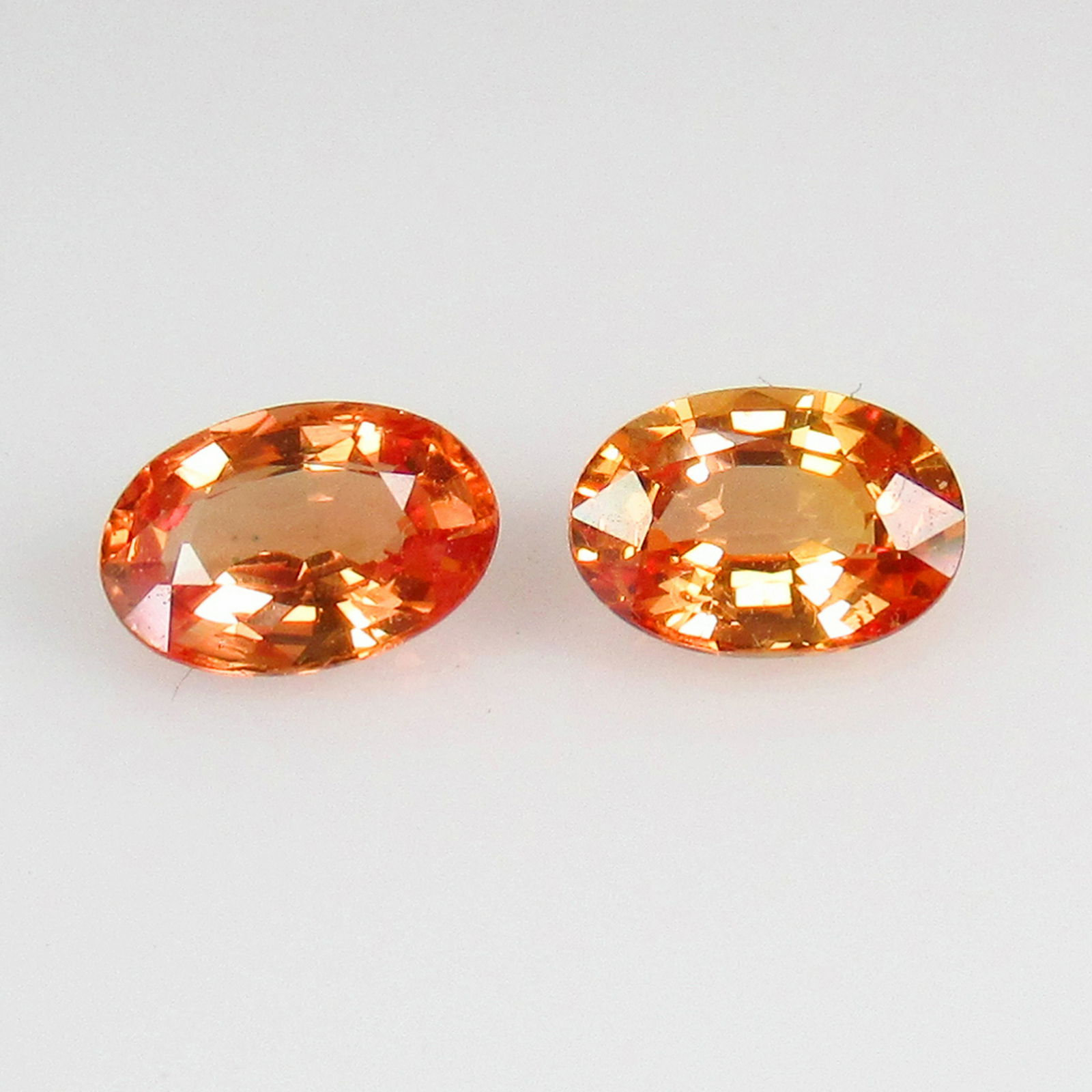 IGI Certified 1.12 Ct Genuine Orange Sapphire Oval Pair (1 of 3)