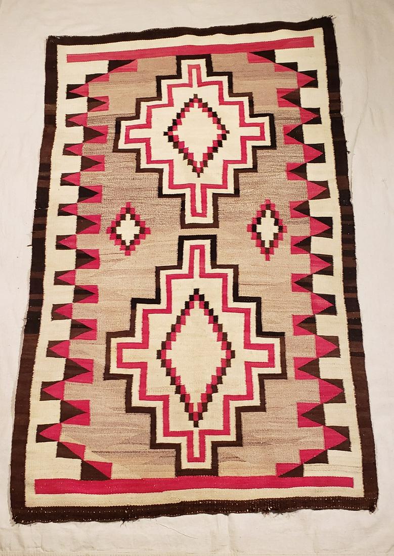 Navajo Woven Regional Rug Ca 1920's: Title: Navajo Woven Regional Rug Ca 1920's Dimension: 57 1/2" x 35" Provenance:Very good condition. Probably Ganado area. Bold pattern and design with an unusual border treatment. Very minor wear to o