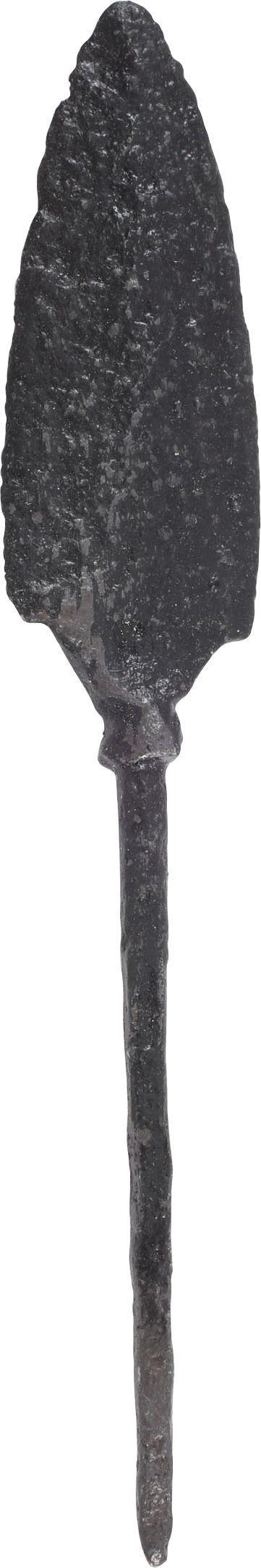 VIKING TANGED ARROWHEAD, C.850-1000 AD: 4” length with finely forged point. The sides of convex profile with notched, near barbed bottom. Thick section, medially ridged both sides with base indent transitioning to the spread base. The cla
