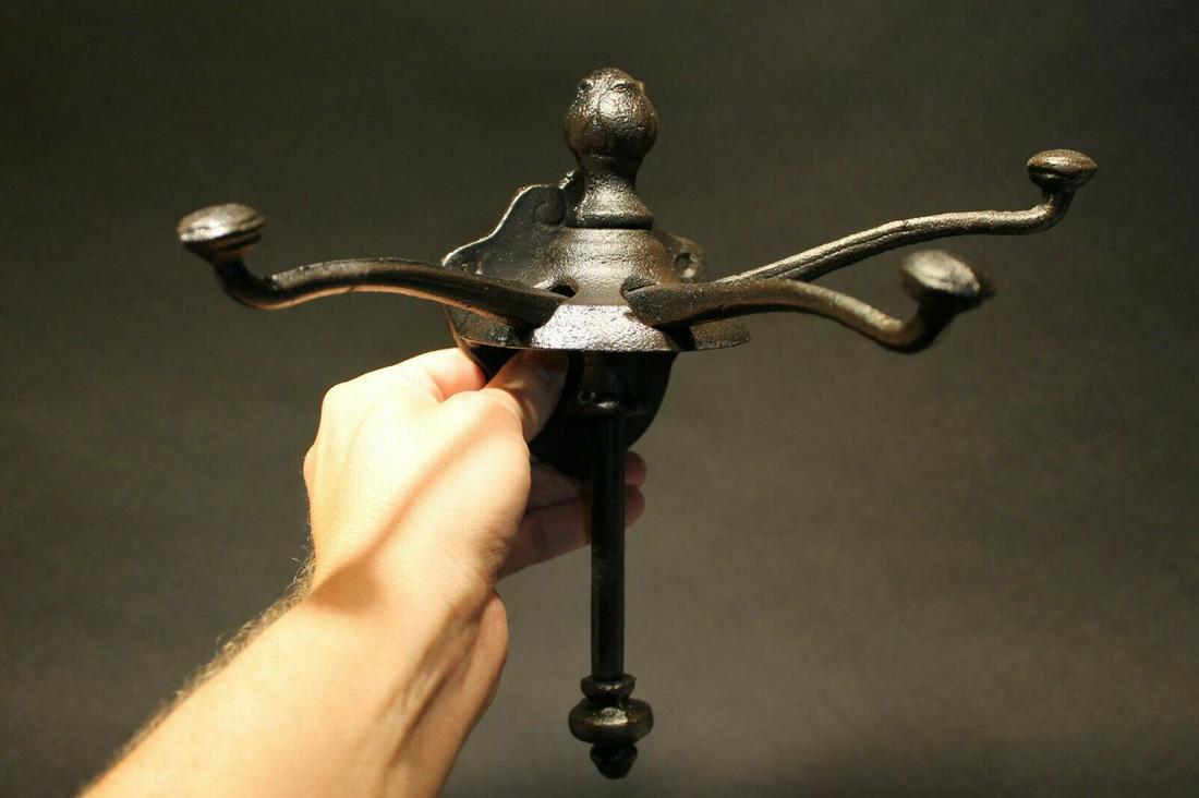 Black Cast Iron Hook Sliding Coat Clothing Hanger: (1) Hook 9 1/2" Tall.. 4 1/8" Wide 7" Extension 1 Charming and functional reproduction sturdy iron wall hook cast from an antique. As you can see this unique and genius design has a slide that allows