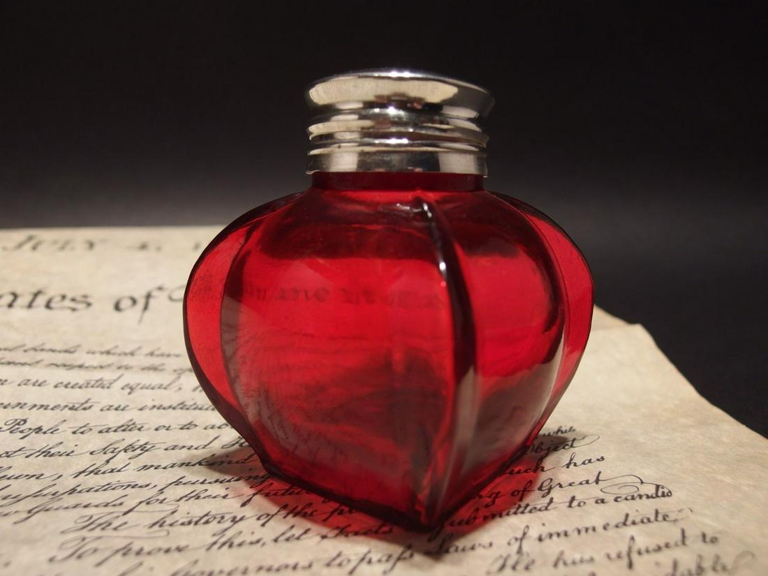 Red Thick Glass Inkwell Ink pot Bottle: 3 1/4" Tall x 2 1/2" Wide Charming reproduction antique red glass inkwell. Very heavy thick glass each with charming subtle signs of being hand made. The hinged shiny lid is silver plated brass. Inkwe