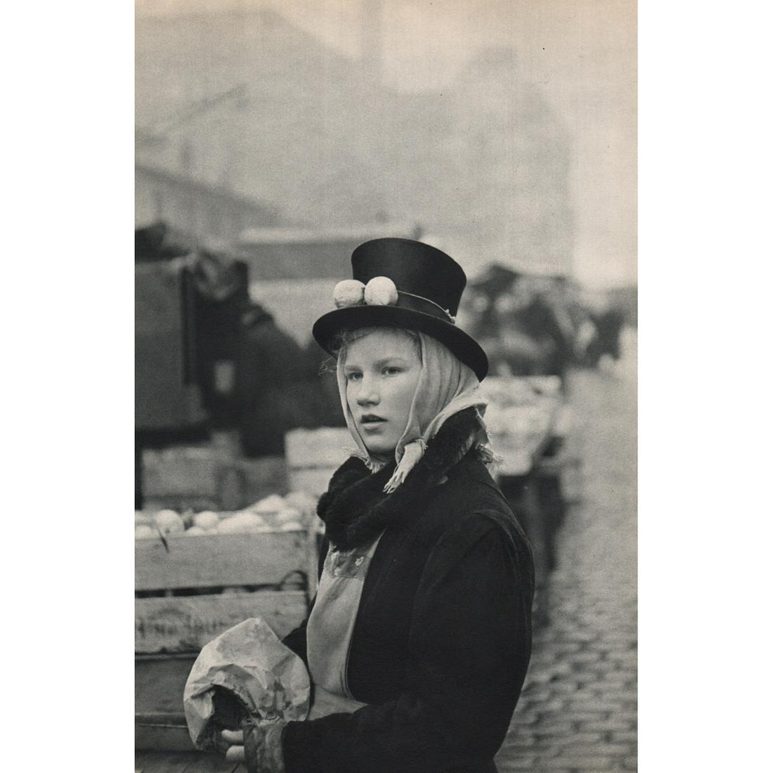 HENRI CARTIER-BRESSON - Girl Selling Lemons at the Fish: Artist: HENRI CARTIER-BRESSON Print Title: Girl Selling Lemons at the Fish Market, Hamburg Medium: Sheet-fed Gravure Printing Date: 1950's Printed in France Image Size approx: 9 x 13.5 inches Henri Ca