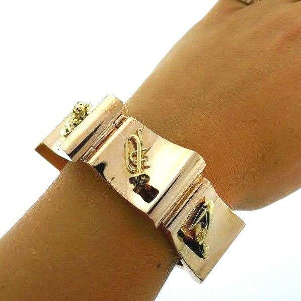 Retro 1940 14K 585 Yellow Gold Bold Bracelet Attached: KG N000 Retro 1940 14K 585 Yellow Gold Bold Bracelet Attached Charms Whimsical, Stamped Â· Weight: 100.4 g Â· Material: 14K Yellow Gold Â· Measurements: 7- 3/8Â” x 1Â” Â· Details: Unique