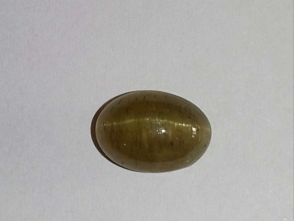 8.66 ct apatite cat`s eye: No Reserve! Title: 8.66 ct apatite cat`s eye Color/Clarity: brown green/transparent Gemstone Type: natural/untreated Carat Weights: 8.66 Size/Dimensions: 12.60x8.89x8.43 mm. Shipping: Domestic: Flat-r