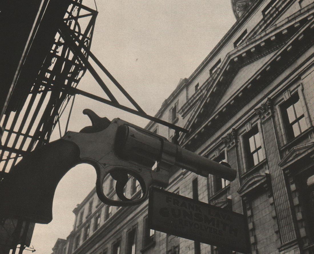 BERENICE ABBOTT - Gunsmith Sign: Artist: BERENICE ABBOT Print Title:Gunsmith Sign Medium: Photoengraving Printed in: The USA, 1930’s Image Size: approx. 7 x 8.5” Berenice Abbott (1898 – 1991),was an American photographer best k