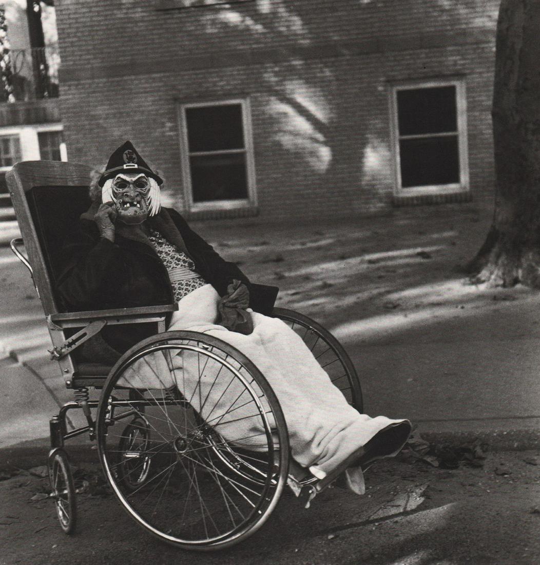 DIANE ARBUS - Masked Woman in a Wheelchair, PA,1970: Artist: DIANE ARBUS Print Title: Masked Woman in a Wheelchair, PA,1970 Medium: Photoengraving Printed 1970’s in the US Image size (inches) approx. 8 x 8.5” Diane Arbus (1923 –1971),was an Americ
