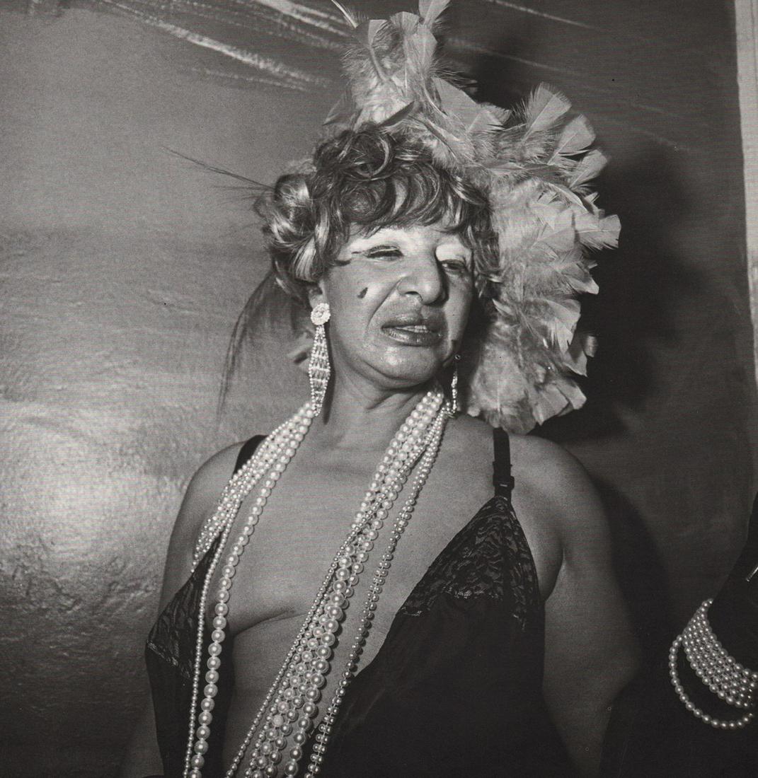 DIANE ARBUS - Transvestite at Drag Ball, NYC, 1970: Artist: DIANE ARBUS Print Title: Transvestite at Drag Ball, NYC, 1970 Medium: Photoengraving Printed 1970’s in the US Image size (inches) approx. 8.5x 8”.5 Diane Arbus (1923 –1971),was an Americ