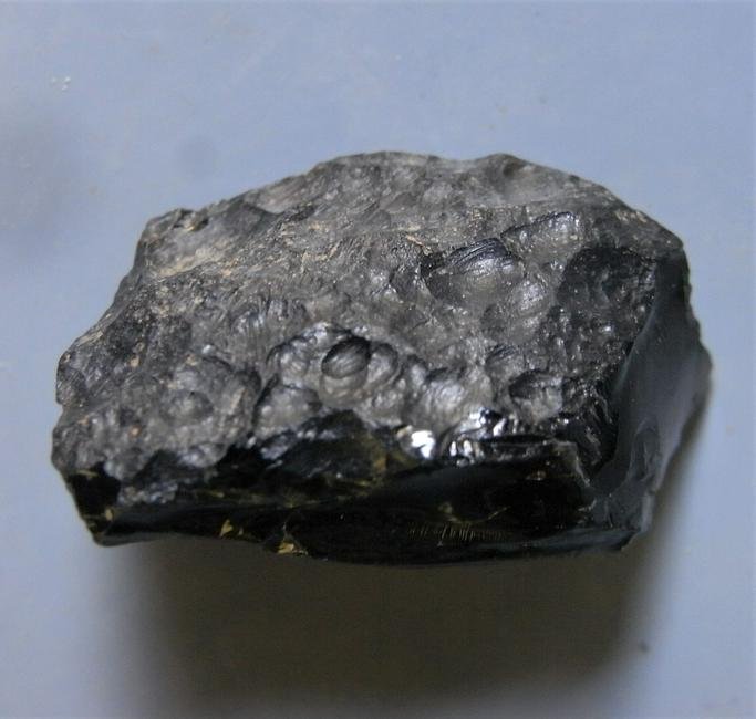 THAILANDITE TEKTITE - FROM METEORITE IMPACT: Title: THAILANDITE TEKTITE - FROM METEORITE IMPACT Origin: Noen Sa-nga. Chaiyaphum Prov. Thailand Size: 2.6x1.5x0.9 cm / 5 gram Description: two sides original, three sides with glassy damage Reserve: