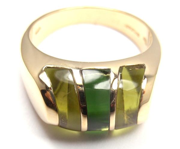 Rare! Authentic Bvlgari Bulgari 18k Yellow Gold Green: More About the Piece: Metal: 18k Yellow Gold Ring Size: 6.5 Measurements: Width: 10mm Weight: 11 grams Stones 1 peridots & 1 green tourmaline Hallmarks: Bulgari 750 1970AL Reserve: $1