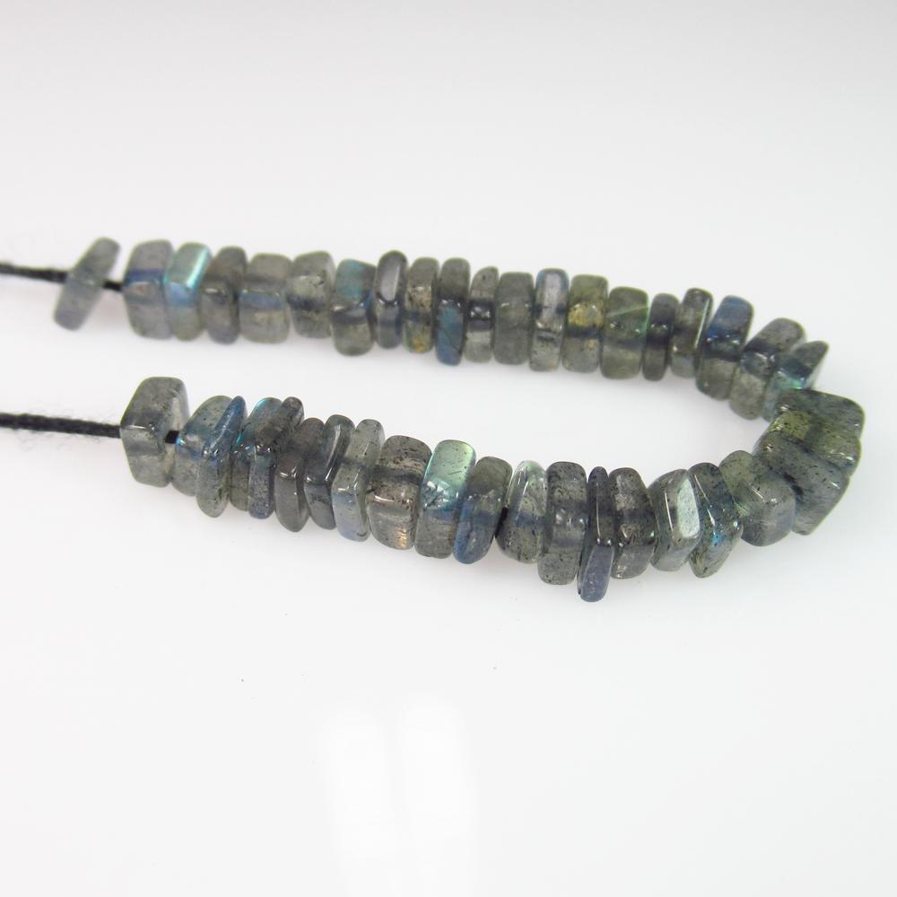 14.72 Ct Genuine 41 Labradorite Drilled Square Beads: No Reserve! Title: 14.72 Ct Genuine 41 Labradorite Drilled Square Beads Stone Clarity: Transparent Gemstones: Natural Labradorite Beads Carat Weights: 14.72 Size/Dimensions: 4.5x1.9 to 4.7x1.8 mm / 41