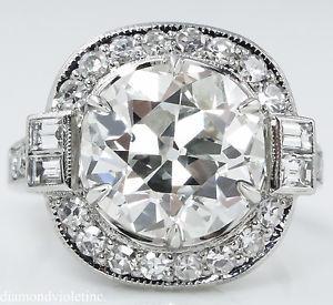 GIA 5.44ct Antique Vintage Art Deco Old European: This SUPER RARE Stunning Vintage Handmade Platinum (stamped) Halo Engagement ring dazzles with GIA Certified 4.54CT OLD EUROPEAN Center Diamond K color, VS2 clarity (appear white and very CLEAR), very