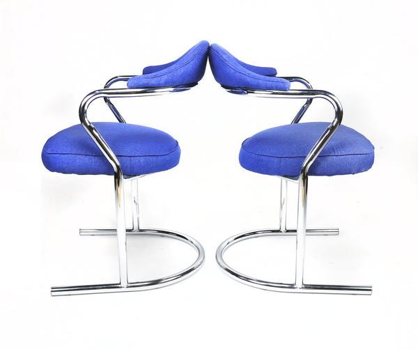 Pair of Anton Lorenz for Thonet Chrome Chairs: A Pair of tubular chrome cantilevered arm chairs attributed to Anton Lorenz for Thonet that fit perfectly with today's style. Sculpted chrome design with a minimal modern style. Professionally re-upho