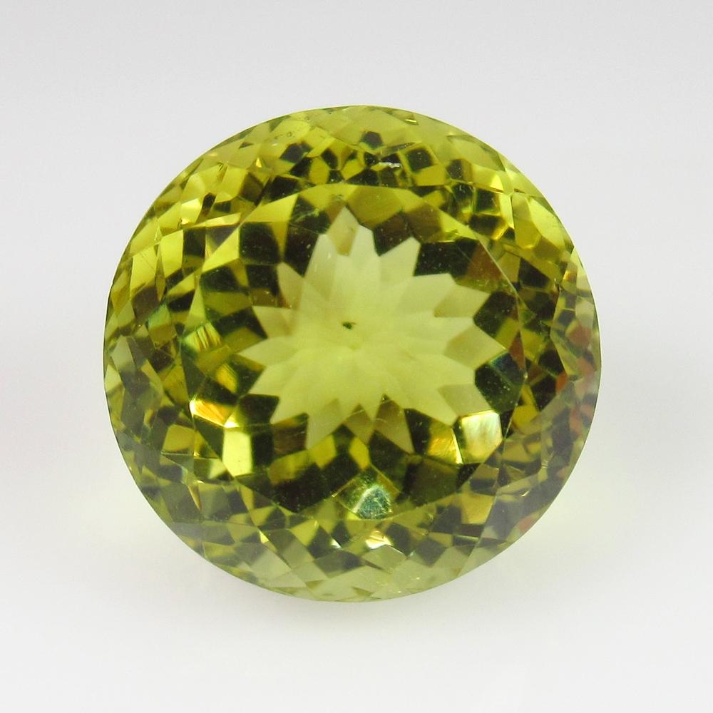 18.21 Ct Geuine Lemon Quartz 15.5 mm Round Cut: Title: 18.21 Ct Geuine Lemon Quartz 15.5 mm Round Cut Stone Clarity: VVS Gemstones: Lemon Quartz Carat Weights: 18.21 Size/Dimensions: 15.50 x 15.50 x 13.10 mm Additional Information: Good Luster / To