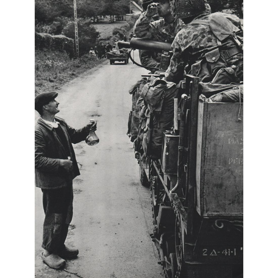 ROBERT CAPA - Patton's 4th Armored Division: Artist: ROBERT CAPA Print Title: Patton's 4th Armored Division moving toward Brittany Medium: Sheet-fed Gravure Printing Date: 1960's Printed in Italy Image Size approx: 12.5 x 9.5 inches Robert Capa