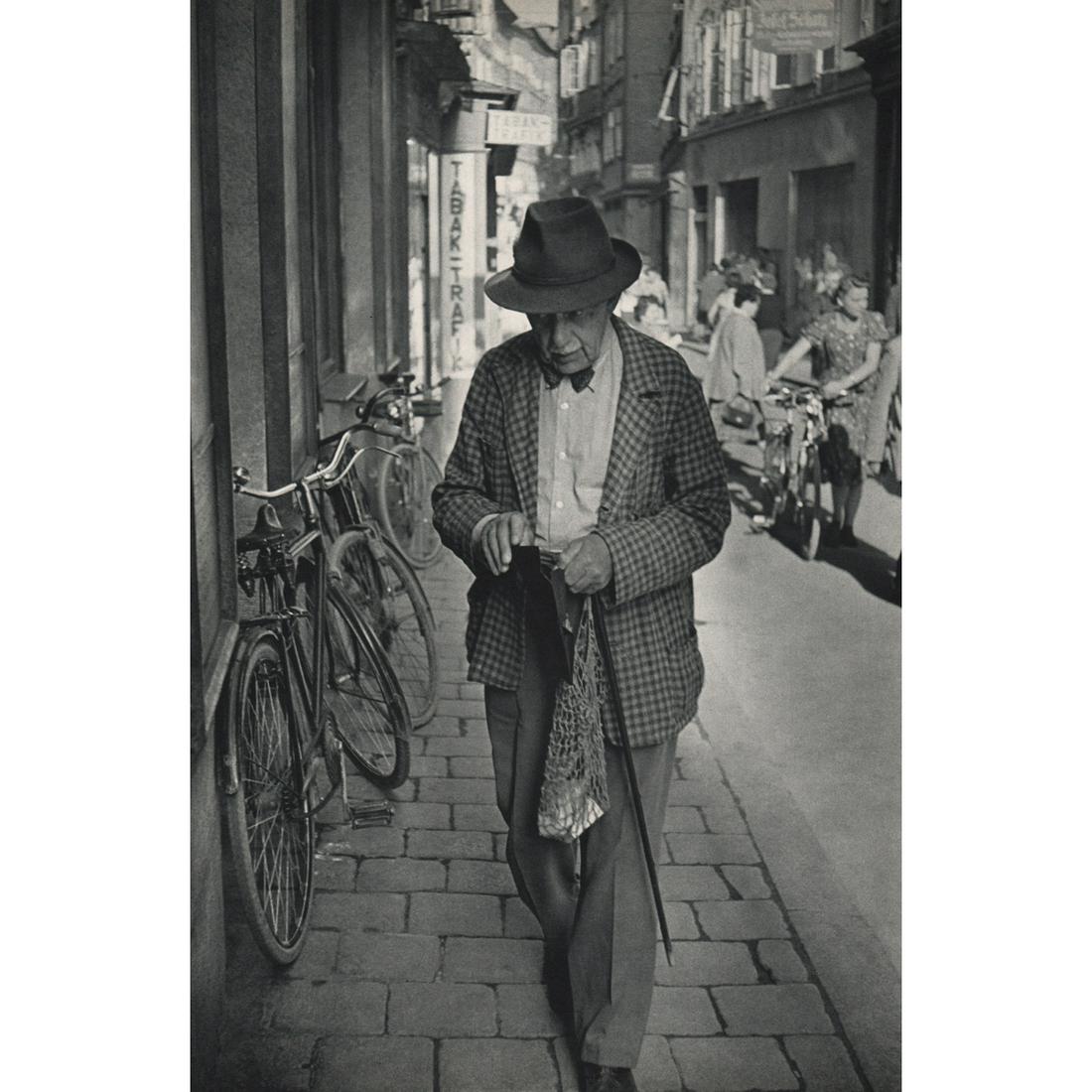 HENRI CARTIER-BRESSON - In the Getreidegasse, Salzburg: Artist: HENRI CARTIER-BRESSON Print Title: In the Getreidegasse, Salzburg Austria Medium: Sheet-fed Gravure Printing Date: 1950's Printed in France Image Size approx: 13.5 x 9 inches Henri Cartier-Bre