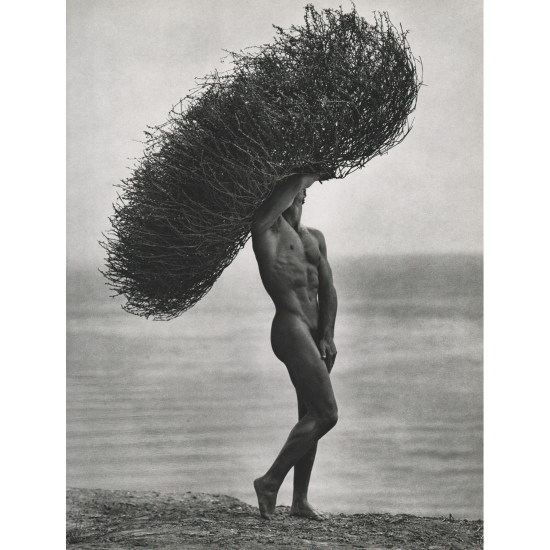 HERB RITTS - Male Nude with Tumbleweed, 1986: Artist: HERB RITTS Print Title: Male Nude with Tumbleweed in Paradise Cove, 1986 Medium: Sheet-fed Gravure Printing Date: 1980's Printed in Japan Image Size approx: 14 X 11 inches Herb Ritts (1952-200
