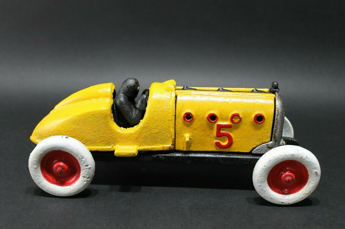 Cast Iron #5 Toy Race Car w Lifting Hood: 9 1/2" Long x 3 1/2" Wide 3 3/4" Tall 2 lbs 13 oz Such a neat reproduction cast iron car! As you can see this heavy cast iron car was wonderfully hand painted and distressed to look original. The car