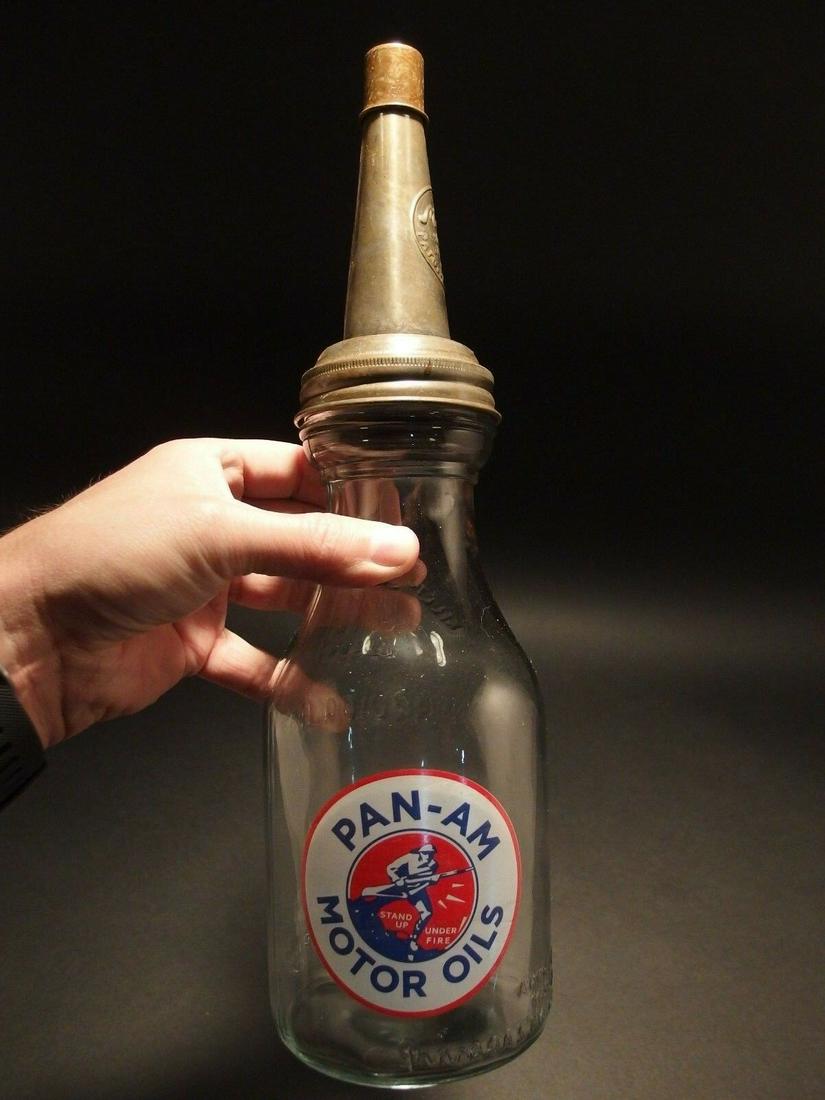 "Pan AM Motor Oil" Bottle with Spout: 14" tall x 3 3/4" Wide Well made reproduction antique Pan-Am Motor Oil 1 quart oil bottle. Comes with the spout as shown. Reserve: $25.00 Shipping: Domestic: Flat-rate of $15.00 to anywhere within the