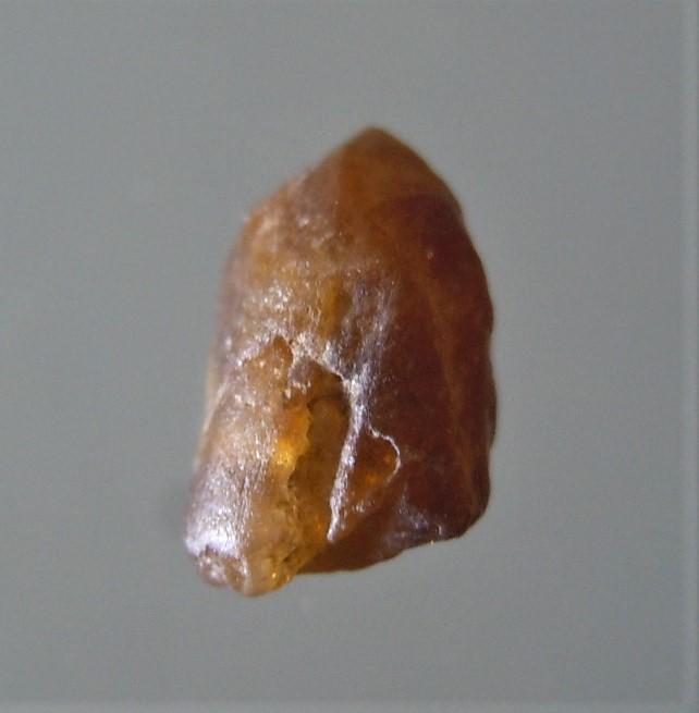 0.95 CT TRANSLUCENT BROWN ZIRCON - UNTREADED GEMSTONE: No Reserve! Title: 0.95 CT TRANSLUCENT BROWN ZIRCON - UNTREADED GEMSTONE Origin: Baw Gaew, Ratanakkiri, Cambodia Size: 0.93x0.34x0.34 / 0.19 gram rounded brown, translucent zircon Shipping: Domestic: 