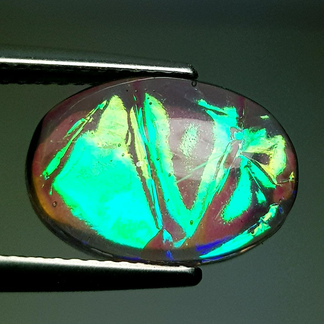 Australian Doublet Opal 5.95 ct: No Reserve! Title: Australian Doublet Opal 5.95 ct Color/Clarity: Semi Transparent Loosegemstone Carat Weights: 5.95 Size: 14.20 x 10.10 x 5.40 Oval - Australia Shipping: Worldwide: Flat-rate of $10.0
