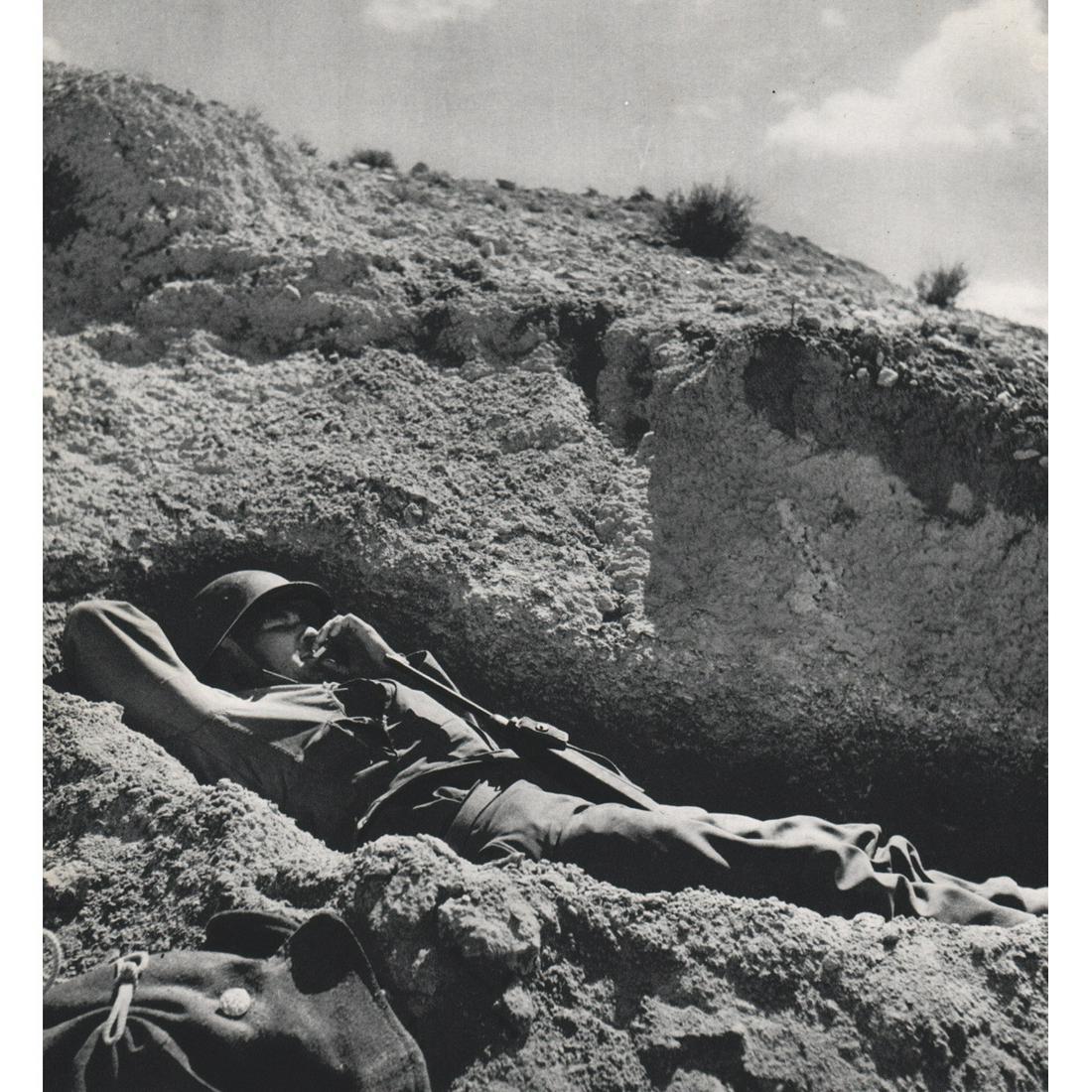 ROBERT CAPA - Soldier in North Africa, WWII: Artist: ROBERT CAPA Print Title: Soldier in North Africa, WWII Medium: Sheet-fed Gravure Printing Date: 1960's Printed in Italy Image Size approx: 10 x 9.5 inches Robert Capa (1913-1954) was a Hungari