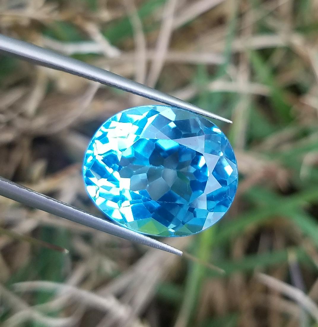 11.7 Carats Beautiful Swiss Blu Topaz: Title: 11.7 Carats Beautiful Swiss Blu Topaz Origin:Swiss Gemstones: Topaz Carat Weights: 11.7 Carats Size/Dimensions: 15x12x8 MM Additional Information: Natural Reserve: $50.00 Shipping: Domesti