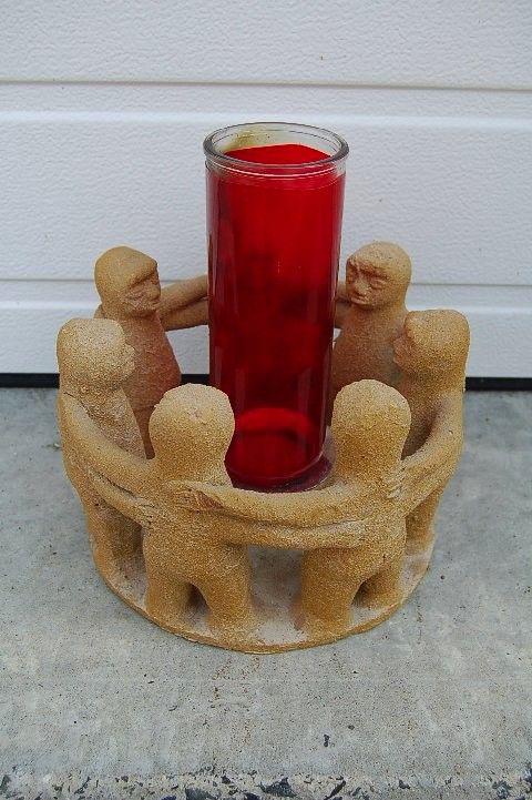 Older Fired Clay Candle Holder with 7 Figures holding: Older Fired Clay Candle Holder with 7 Figures holding hands chalice co (#727) This is a very nice and unique candle holder as shown It has 7 figures all around in a circle holding hands with the canld