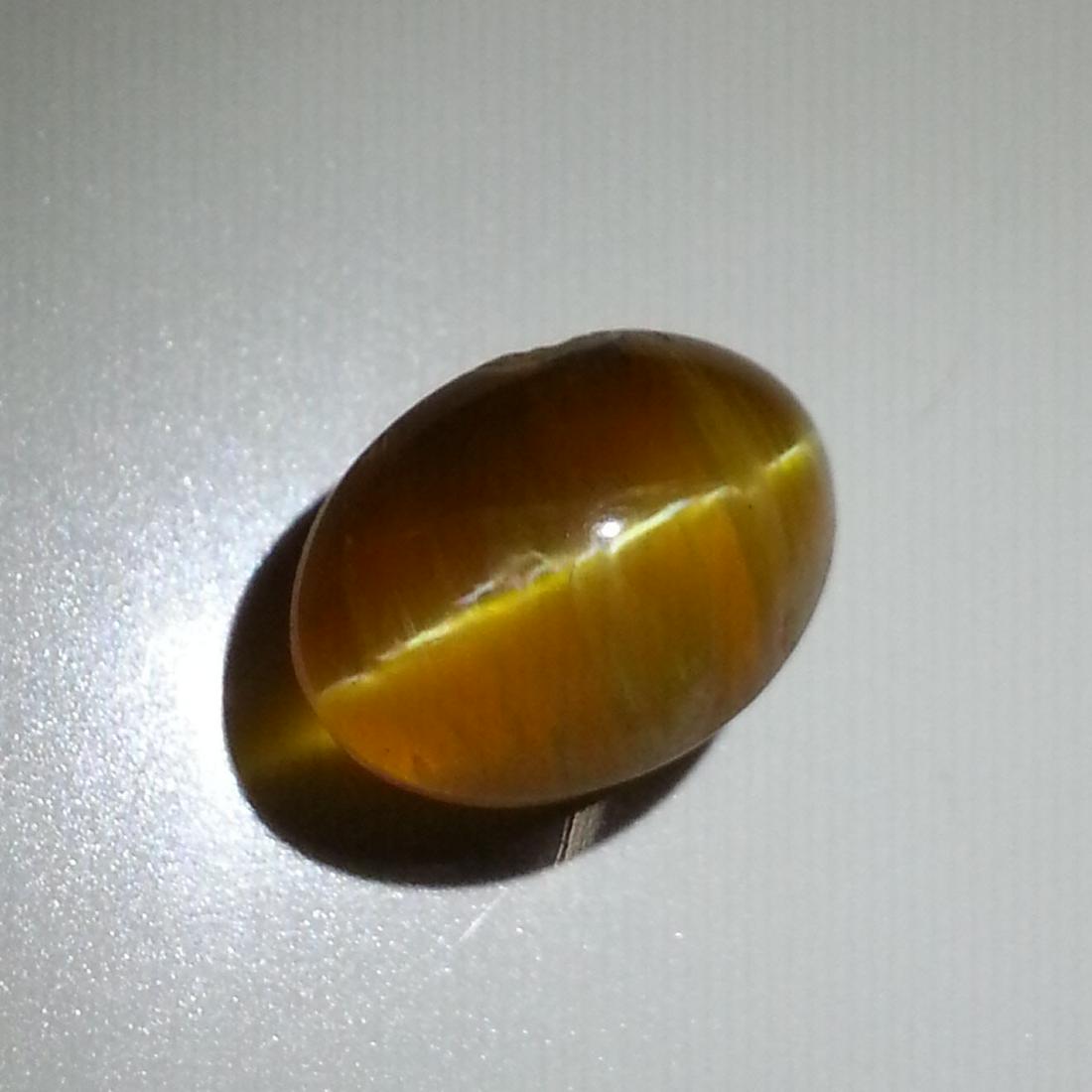 9.00 ct Natural Opal Cat's Eye: No Reserve! Title: 9.00 ct Natural Opal Cat's Eye Color/Clarity: Semi Transparent Gemstones: Loosegemstone Carat Weights: $9 Size/Dimensions: 15.30 x 11.90 x 9.80 Additional Information: Oval - Africa