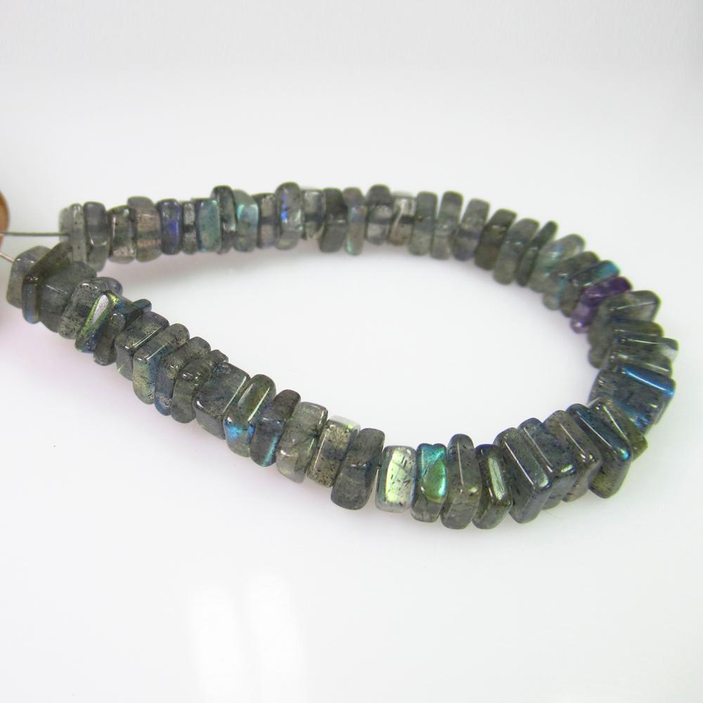 19.77Ct Genuine 42 Labradorite Drilled Square Flat: No Reserve! Title: 19.77Ct Genuine 42 Labradorite Drilled Square Flat Beads Stone Clarity: Transparent Loose Gemstone: Natural Labradorite Beads Carat Weights: 19.77 Size/Dimensions: 4.3x2.1 - 5.0x1.8