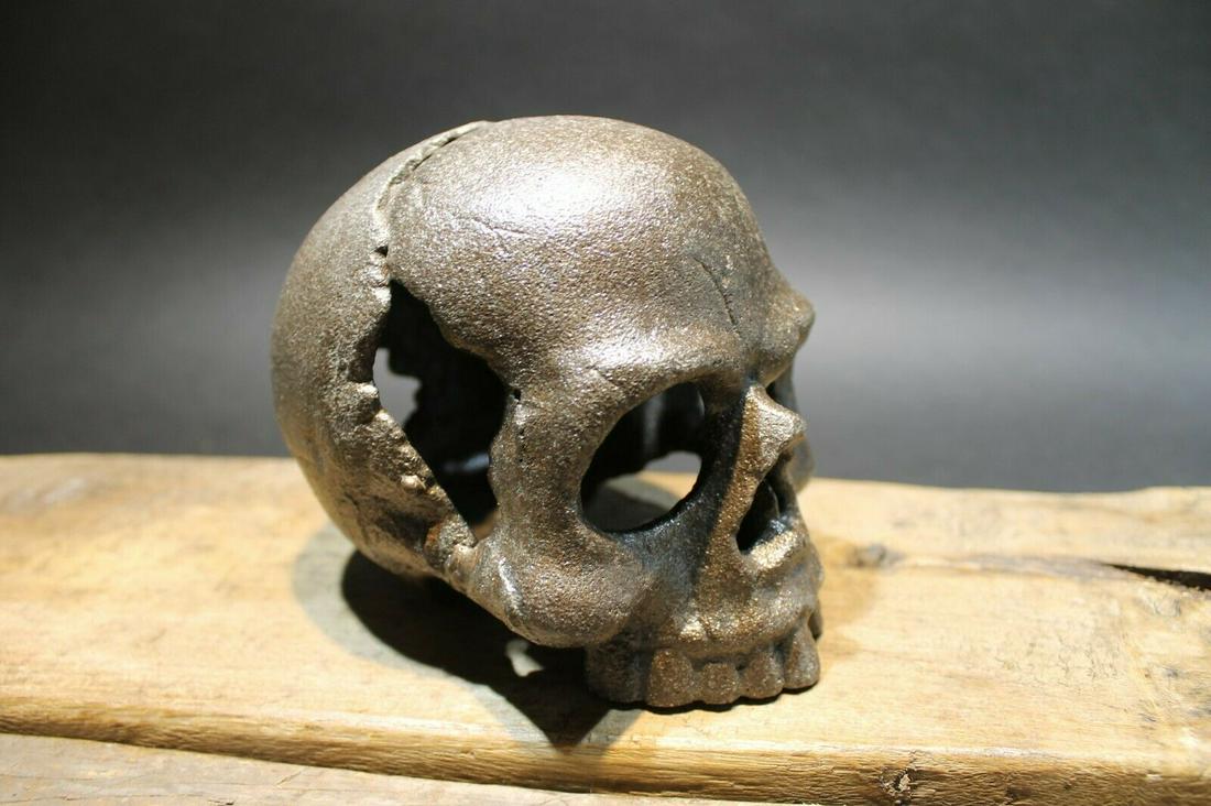 Cast Iron Skull Paperweight: 5" tall x 4 1/4" W x 5" Long Such neat reproduction antique cast iron skull paperweight. Surprisingly heavy at 3 lbs. Certain to impress. Reserve: $30.00 Shipping: Domestic: Flat-rate of $17.00 to any