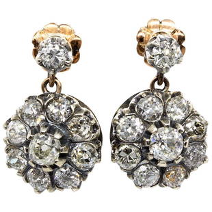 Victorian 18 Karat Gold and Silver Diamonds Earrings: This fascinating design is centered with 2 old mine cut diamonds of H-SI2 quality that weigh 0.8ctw. The flawless central stones are surrounded by 18 old mine cut diamonds of H-SI2 that weigh