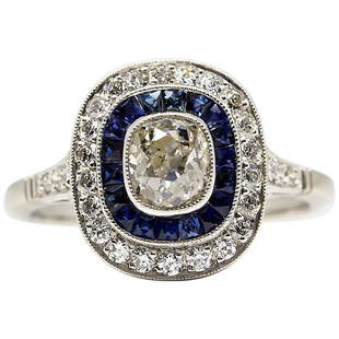 Platinum Handmade Old Mine Diamonds and Sapphires Ring: Composition: Platinum Stones: • 1 cushion old mine cut diamond J-SI2 0.80ctw • 28 old mine cut diamonds H-VS2 0.45ctw • 18 natural French cut sapphires 0.50ctw Ring size: 7 ¼ Ring face: 13mm