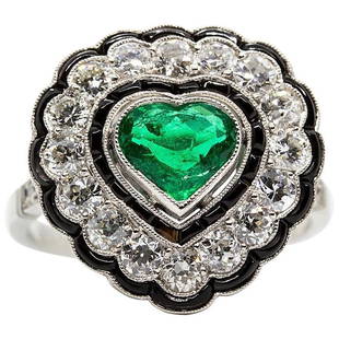 Estate Platinum Emerald Onyx and Diamond Ring: Composition: Platinum Stones: • 1 Natural emerald 1ctw approx. • 22 Old mine cut diamonds H-VS2 1.50ctw • 32 calibrated cut onyxes Ring size: 7 ¾ Ring face: 18mm by 18mm Rise above finger: 7mm.