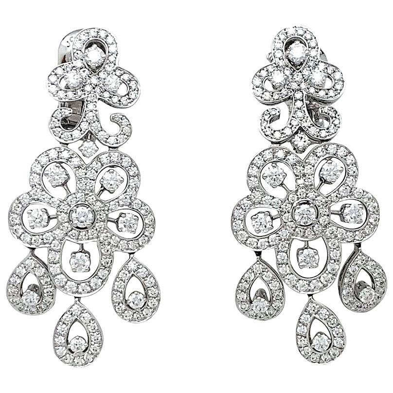 White Gold Van Cleef & Arpels Diamonds Earrings: A 750/000 white gold Van Cleef & Arpels earrings, "Dentelle" collection, figuring flowers motif, enhanced with brilliant cut diamonds. Diamond weight : 3.77 carats Details Creator Van Cleef & Arpels O