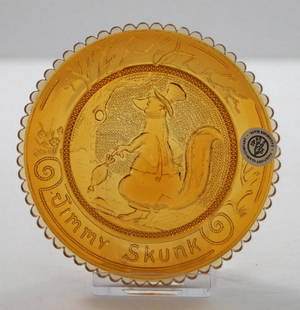 Jimmy SkunkPairpoint Cup Plate: Title: Jimmy SkunkPairpoint Cup PlateDimension: App. 3 ½” diameter.Provenance:A Pairpoint Cup Plate, produced in 1978, Jimmy Skunk design, Amber / Yellow color with 60 scallop rim. When the