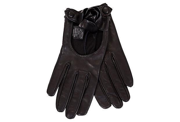 Ferragamo Black Lambskin Rose Gloves: Condition: Excellent Era: Contemporary; 2000s Dimensions: 8" L x 3" W Materials: leather/silk Color: black/silver Salvatore Ferragamo black lambskin gloves with a single rose flower decoration on each