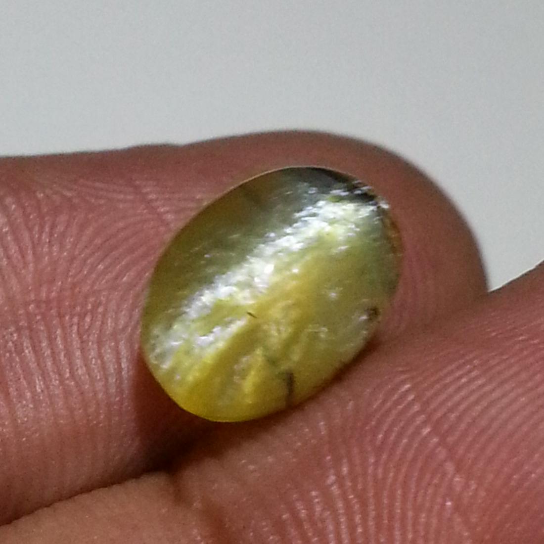 3.45 ct Natural Opal Cat's Eye: No Reserve! Title: 3.45 ct Natural Opal Cat's Eye Color/Clarity: Semi Transparent Loosegemstone Carat Weights: 3.45 Size/Dimensions: 10.50 x 7.80 x 7.70 Oval - Africa Shipping: Worldwide: Flat-rate of
