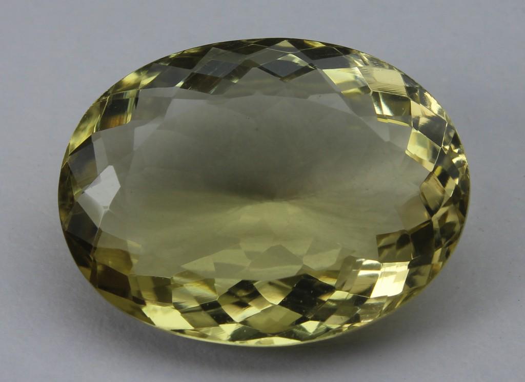 14.52 Ct Natural Lemon Quartz: No Reserve! Title: 14.52 Ct Natural Lemon Quartz Additional Information: Gemstone : Lemon QuartzOrigin : BrazilWeight in carats : 14.52Size : 19.8x14.9x7.8Shape : Oval CutColor : Greenish YellowClarit