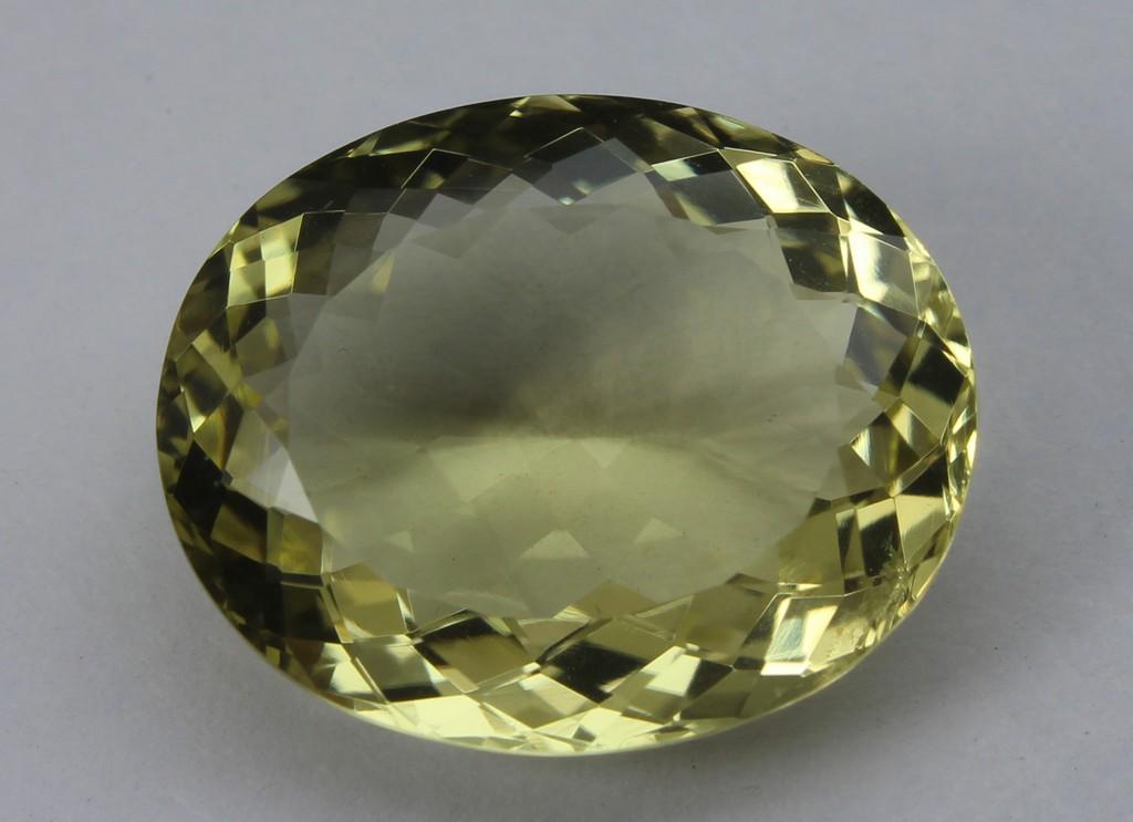12.05 Ct Natural Lemon Quartz: No Reserve! Title: 12.05 Ct Natural Lemon Quartz Additional Information: Gemstone : Lemon QuartzOrigin : BrazilWeight in carats : 12.05Size : 18x14.5x7.5 mmShape : Oval CutColor : Greenish YellowClari